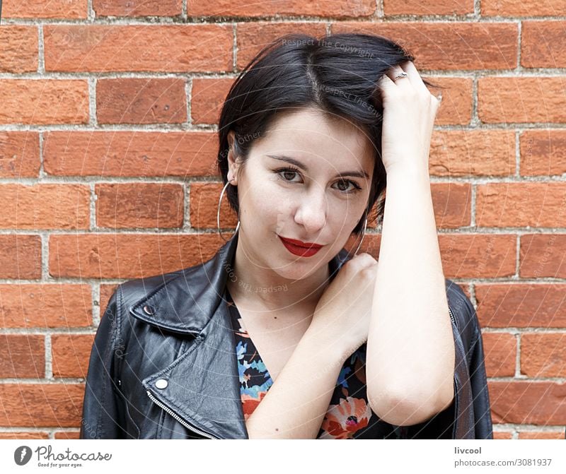 Smiling young woman against a brick wall , San Sebastian Lifestyle Style Happy Beautiful Summer Human being Feminine Homosexual Young woman Youth (Young adults)