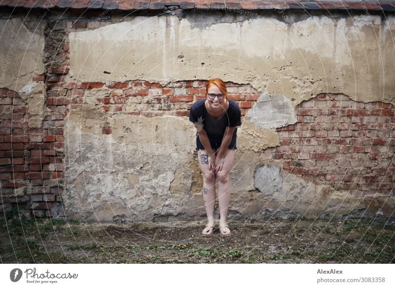 Portrait of a young woman in front of an old brick wall Style already Life Wall (barrier) Brick crumble away Derelict Young woman Youth (Young adults)