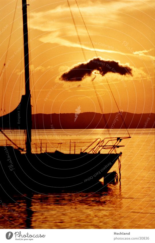 Sailboat in the evening light Clouds Dusk Sun Water Electricity pylon