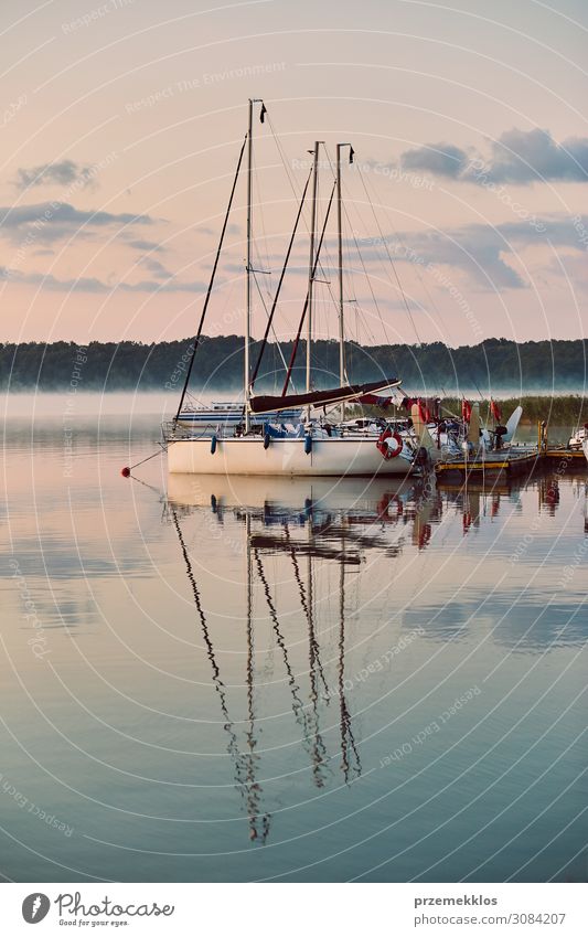 Yachts and boats moored in a harbour Relaxation Leisure and hobbies Vacation & Travel Tourism Cruise Summer Ocean Environment Nature Sky Clouds Coast Lake