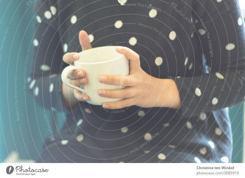 young woman in blue sweater holding a white porcelain mug with tea or coffee in her hands Human being Feminine Tea Young woman Coffee Youth (Young adults) Hand