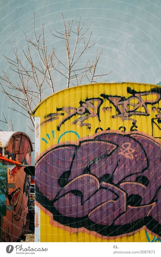 Container Love Tree Deserted Wall (barrier) Wall (building) Site trailer Graffiti Dirty Authentic Town Multicoloured Inspiration Creativity Decline Colour photo