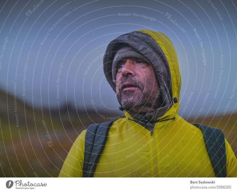 Man in Yellow Raincoat Hiking Outdoors Lifestyle Face Vacation & Travel Trip Adventure Expedition Camping Winter Mountain Climbing Mountaineering Masculine