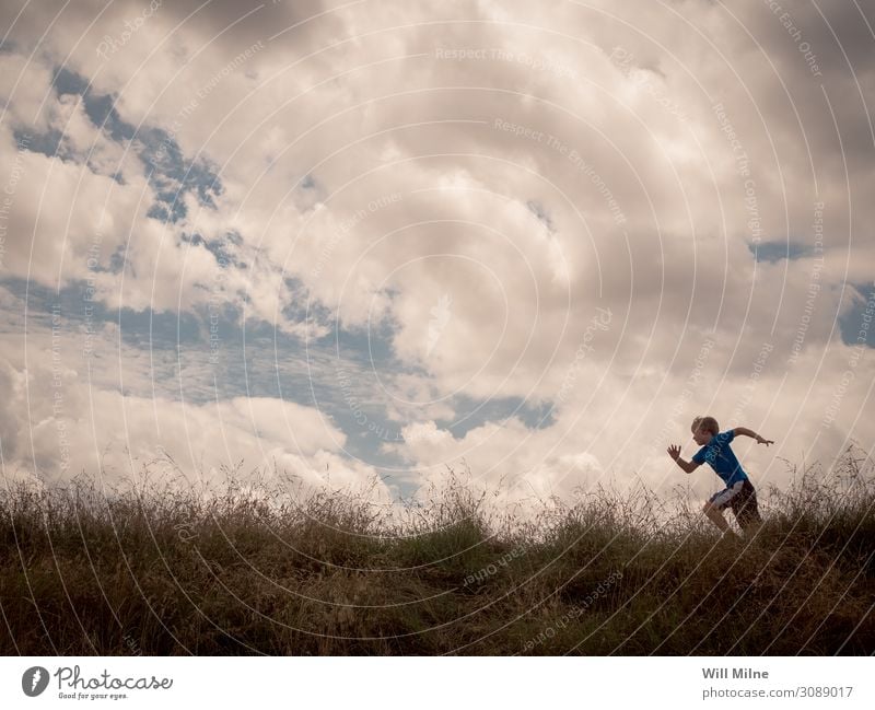 Boy Running Across the Top of a Hill Boy (child) Running sports Runner Clouds Sky Minimal Copy Space Practice Youth (Young adults) Young man Youth culture Child