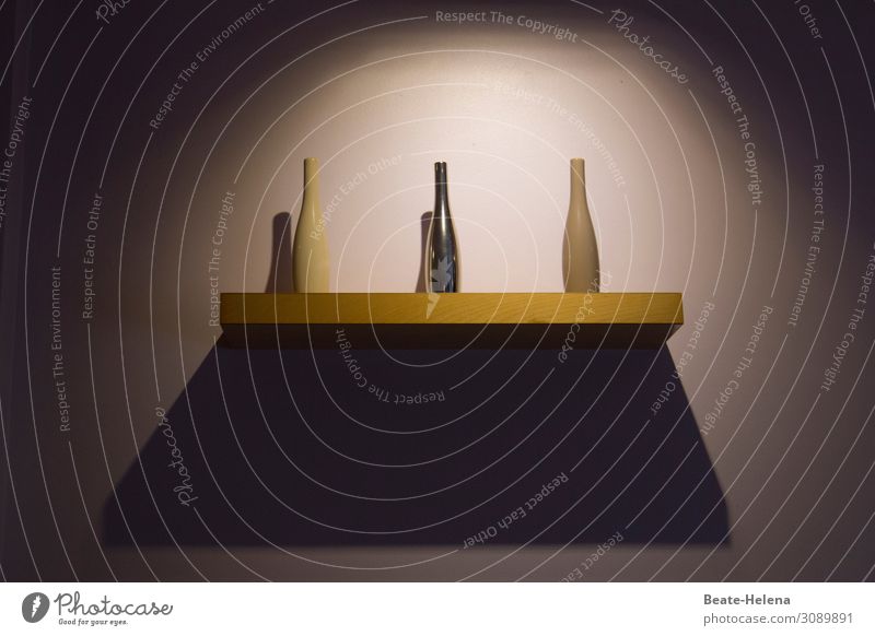 Dreiklang | Three bottles on a shelf in the spotlight cast round and angular shadows Light Shadow Interior shot Spotlight Colour photo Deserted Art object Aura