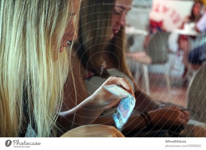 Two teenage girls sitting in a restaurant Young woman Youth (Young adults) Friendship Face Hand 2 Human being 13 - 18 years Giardini Naxos Italy Europe