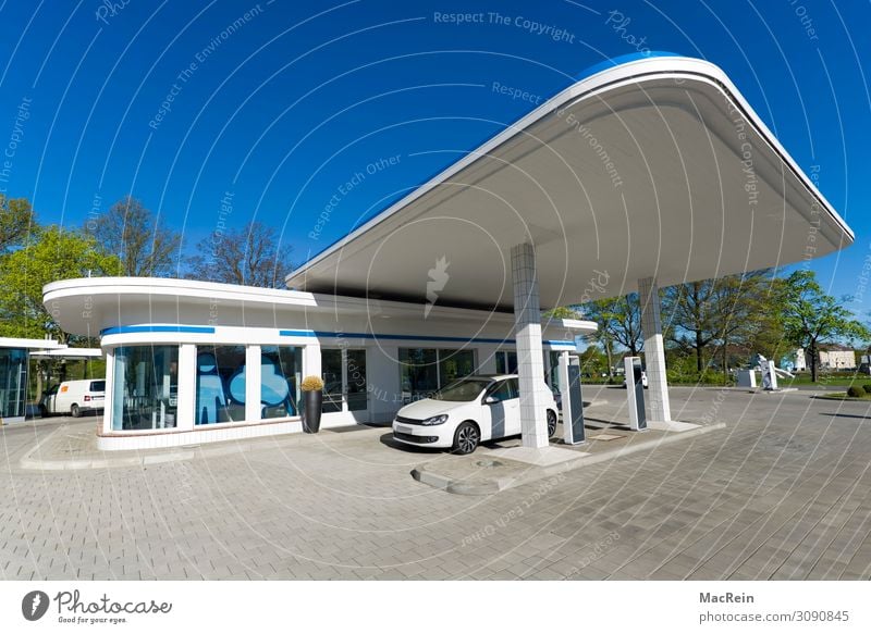 Retro petrol station Architecture Blue White Petrol station Petrol pump electric car e-car electric filling station Modern Copy Space Colour photo Exterior shot