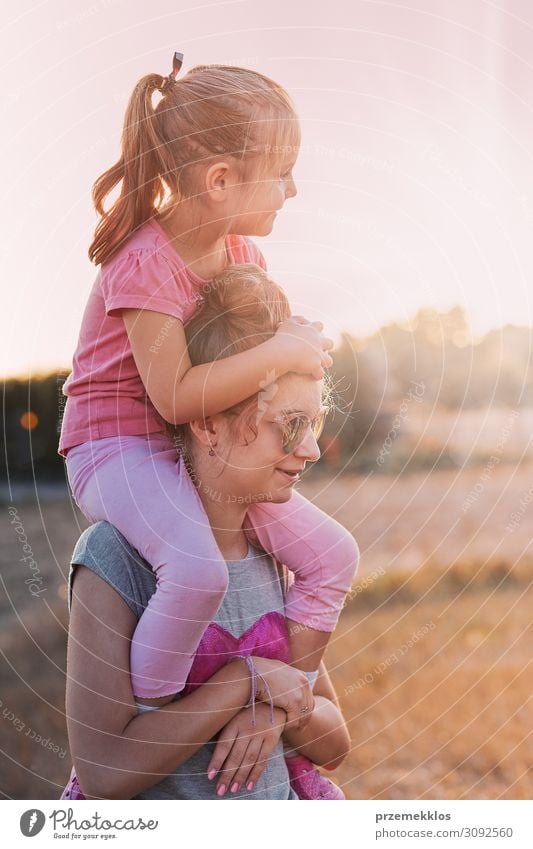 Sisters enjoying piggyback ride Lifestyle Joy Happy Relaxation Playing Vacation & Travel Freedom Summer Summer vacation Sun Sunbathing Child Human being Girl