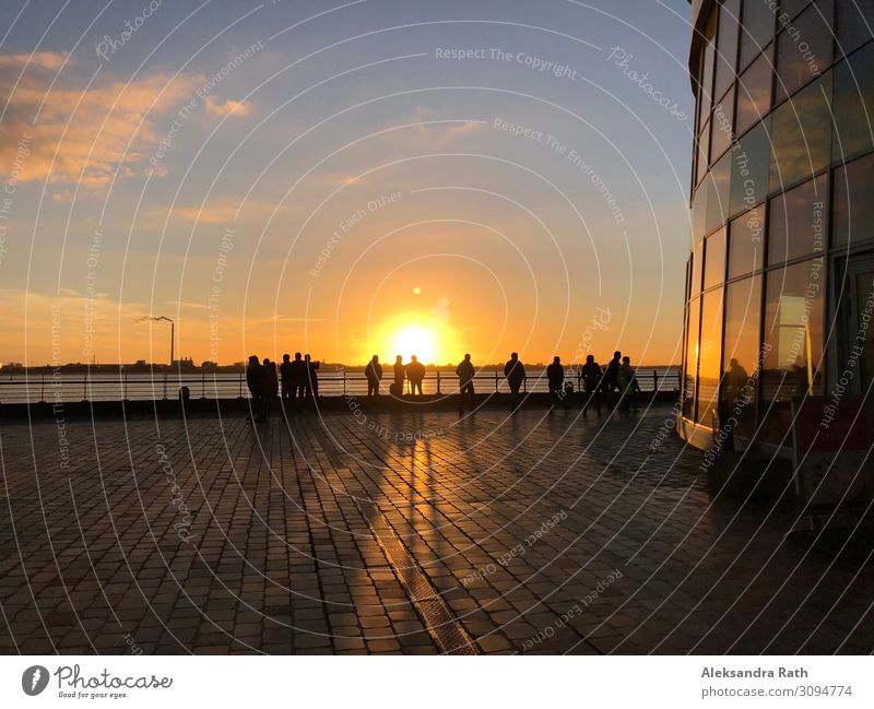 People watching the sunset Vacation & Travel Human being Group Sky Sunrise Sunset Sunlight Beautiful weather Coast North Sea Lake Bremerhaven Germany Europe