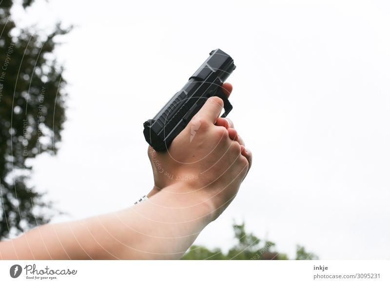 air shot Lifestyle sport shooting Hand 1 Human being Weapon Handgun air pistol To hold on Aim Shoot Starting shot Colour photo Exterior shot Close-up