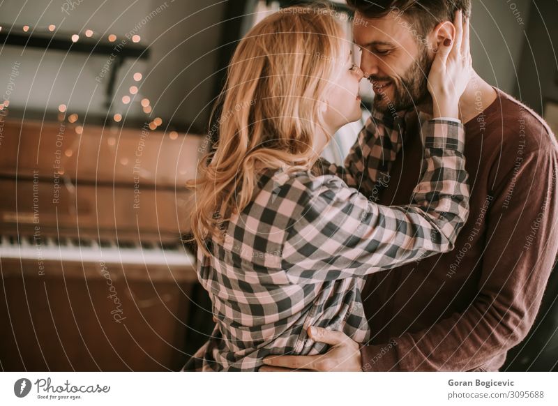 Young man and pregnant woman hugging in the room Happy Beautiful Human being Woman Adults Man Family & Relations Couple 2 Love Embrace Wait Together Pregnant