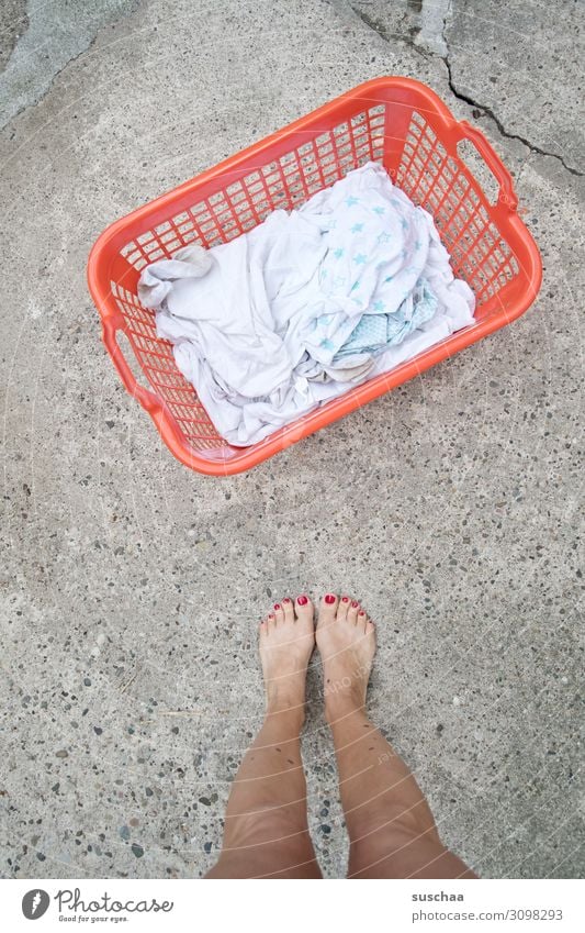 washing day Woman Legs feet Barefoot Exterior shot Warmth Summer Street Laundry Laundry basket white linen Wash Washing day Housewife Emancipation Household