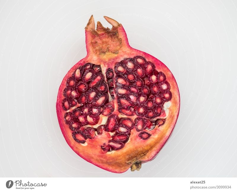 Half pomegranate isolated Fruit Dessert Vegetarian diet Diet Nature Fresh Natural Juicy Red White background Cut food healthy Ingredients Organic piece