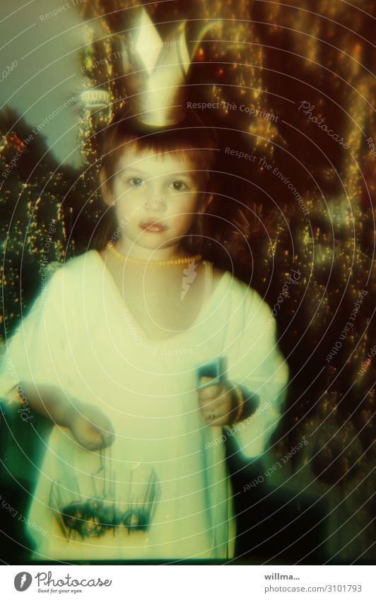 There used to be more tinsel. Analog photo, child with crown playing princess, behind it a Christmas tree with tinsel Child Playing Crown Jewellery Necklace