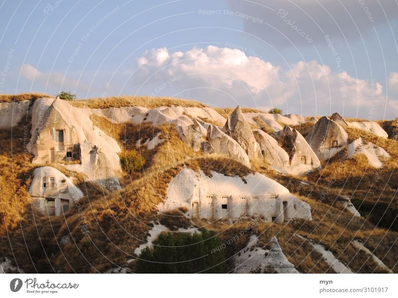 Caves in Cappadocia Valley Tourist Attraction tuff rock Landscape Sky rocky landscape Rock Stone Mountain Vacation & Travel Tourism Sandstone Anatolia Hill