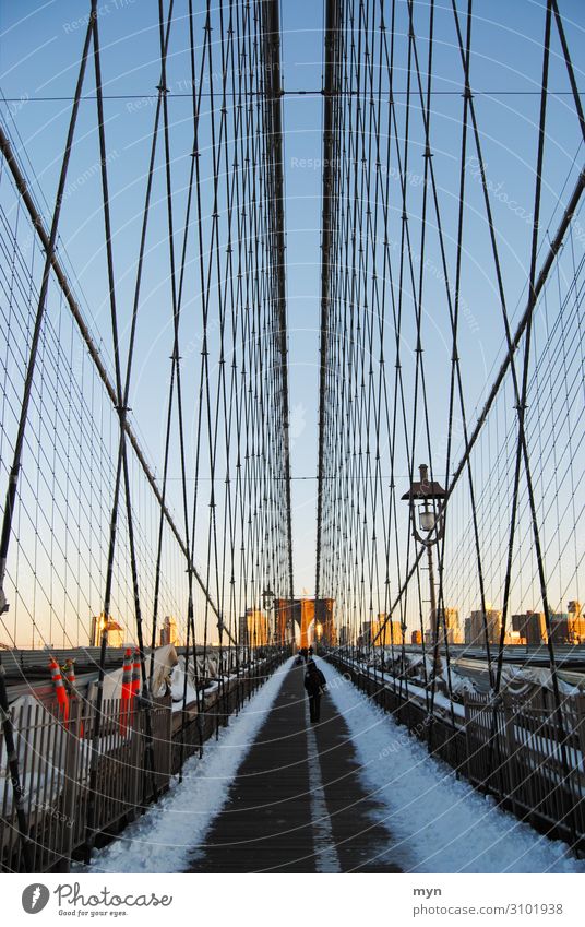 Brooklyn Bridge at sunset with snow and sun Manhattan New York City USA Monument Tourist Attraction Landmark Vacation & Travel Tourism Sightseeing City trip