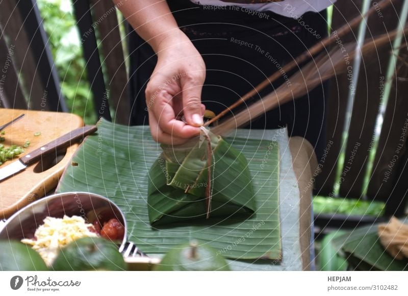 The woman use of natural materials Dessert Bowl Table Man Adults Family & Relations Culture Environment Nature Plant Leaf Packaging Package Observe Authentic