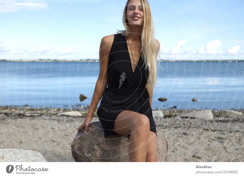 Smiling young woman in black dress at the Baltic Sea Style Joy already Well-being Summer Summer vacation Sun Sunbathing Beach Ocean Young woman