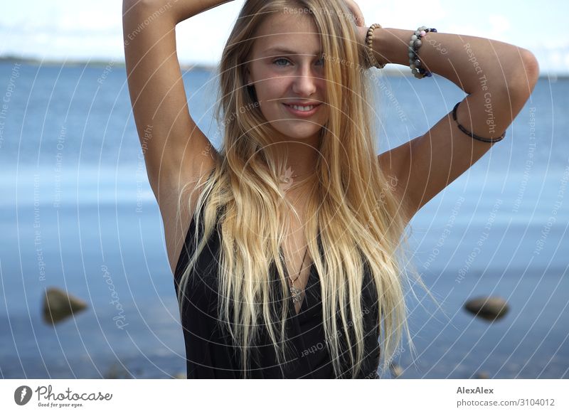 Portrait of a young blonde woman at the sea Joy already Summer Summer vacation Beach Ocean Young woman Youth (Young adults) Model 18 - 30 years Adults Landscape