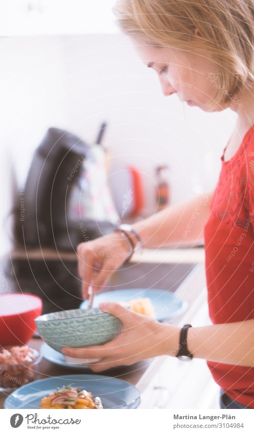 Young woman cooking Nutrition Plate Bowl Healthy Eating Kitchen Feminine Youth (Young adults) 1 Human being 18 - 30 years Adults Contentment Cooking