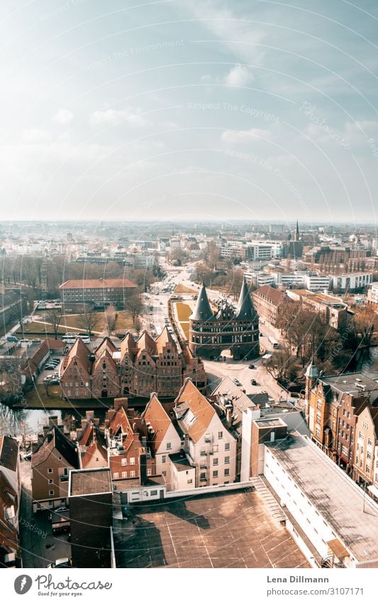 Lübeck from bird's eye view Northern Germany Town orange-teel Wide angle Sky Horizon Bird's-eye view houses Tower spires orangeteel orange and teel holstentor