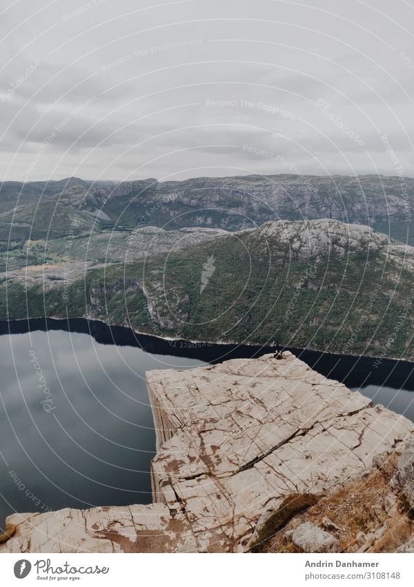 Preikestolen Norway in the morning Environment Nature Landscape Water Clouds Bad weather Rock Mountain Bay Fjord Stone To enjoy Hiking Blue Brown Gray Green