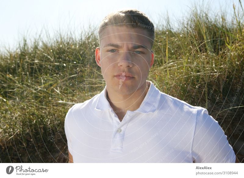 Backlit portrait of a young man in front of a beach dune Lifestyle already Summer Summer vacation Sun Young man Youth (Young adults) 13 - 18 years Landscape