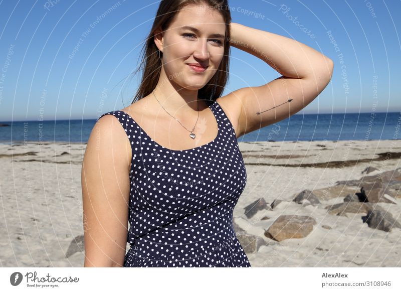 Portrait of a young, tall woman on the beach in a summer dress Style Joy already Life Well-being Summer Summer vacation Sun Sunbathing Beach Ocean Young woman