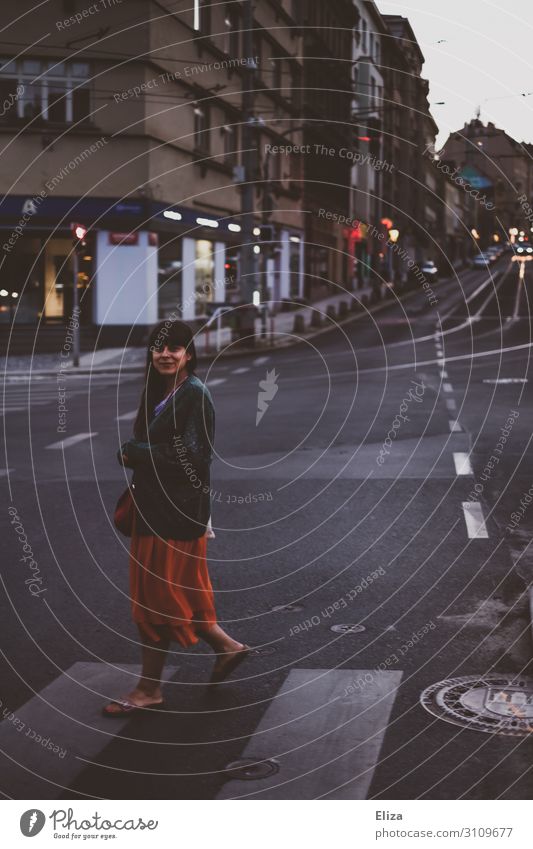 Young woman crossing a crosswalk in the city in the evening Feminine Youth (Young adults) Woman Adults 1 Human being 18 - 30 years Prague Town Pedestrian Street