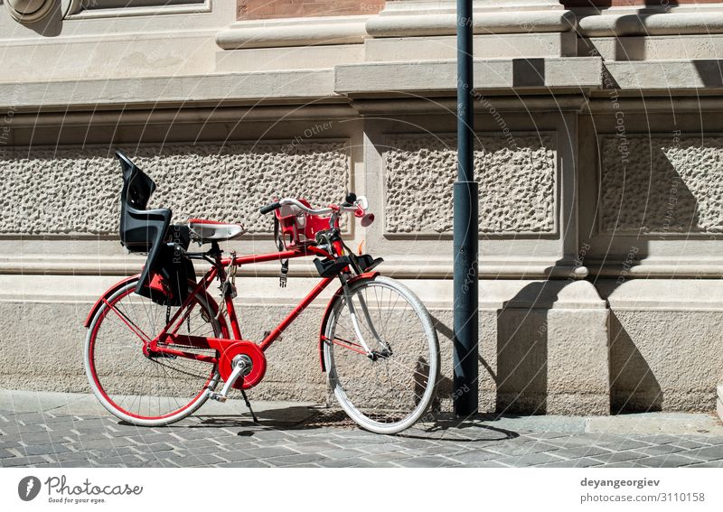 Red bike with basket on italian street. Lifestyle Style Relaxation Vacation & Travel Tourism Summer Sun Sports Cycling Town Transport Street Metal Old Retro