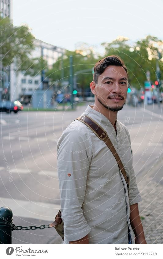 Dark-haired man with shirt and messenger bag in the city centre of Düsseldorf Lifestyle Masculine Young man Youth (Young adults) Man Adults 1 Human being