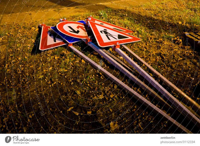 road signs Evening Dark Night Twilight Road sign Bans Rule Construction site Arrangement Traffic regulation Lie Meadow Lawn Deserted Copy Space Oncoming traffic