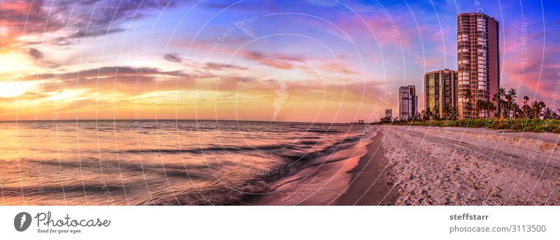 Sunset over North Gulf Shore Beach along the coastline of Naples Calm Ocean Nature Landscape Coast Blue Yellow Gold Orange Pink Horizon Beach Dusk