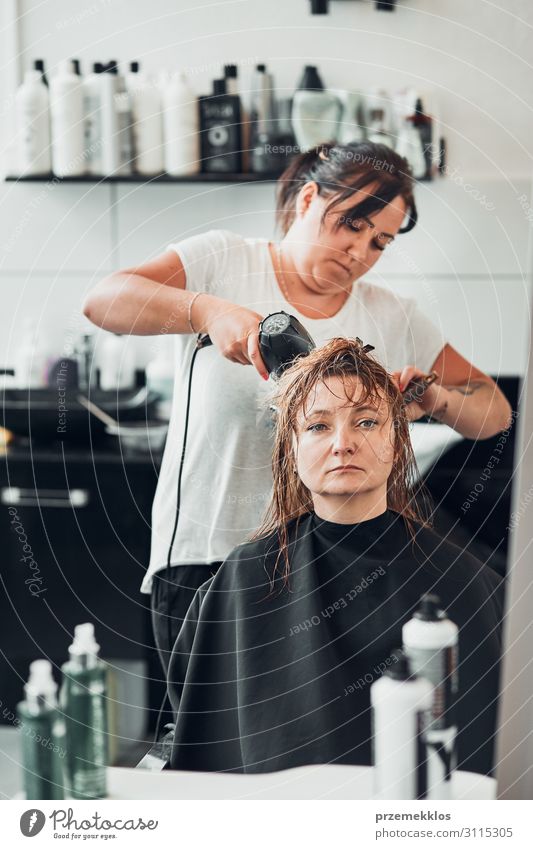 Hairdresser styling womans hair Lifestyle Shopping Style Beautiful Hair and hairstyles Work and employment Profession Scissors Human being Young woman