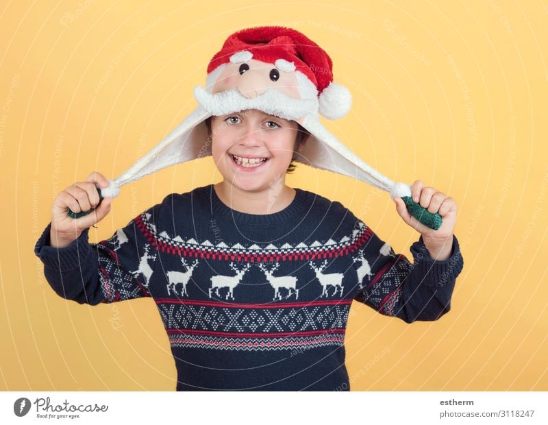 smiling Child Wearing Christmas Santa Claus Hat Joy Happy Winter Feasts & Celebrations Christmas & Advent New Year's Eve Human being Masculine