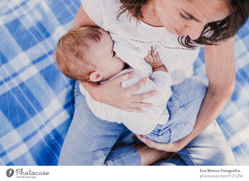 young mother breast feeding her baby girl outdoors in a park Eating Lifestyle Joy Beautiful Summer Sun Parenting Child Feminine Baby Young woman