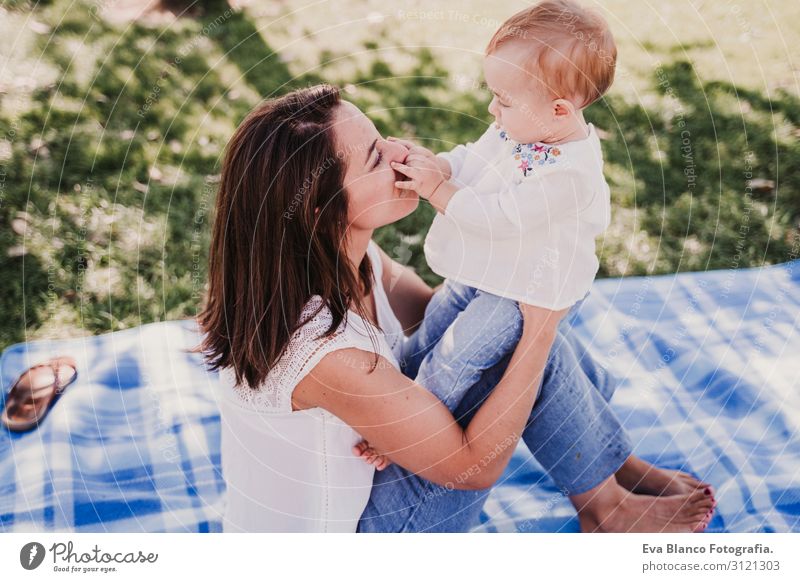 mother playing with baby girl outdoors in a park.family concept Lifestyle Joy Happy Beautiful Playing Summer Sun Parenting Child Baby Woman Adults Parents