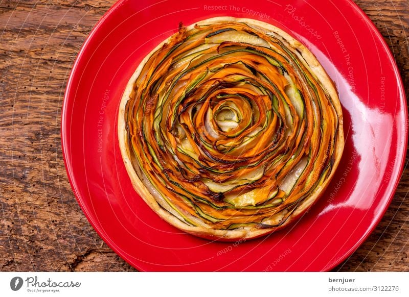 Cake with carrots and courgettes Yoghurt Vegetable Bread Nutrition Lunch Dinner Vegetarian diet Plate Paper Wood Round Green Red Quiche Plank Rustic Hearty