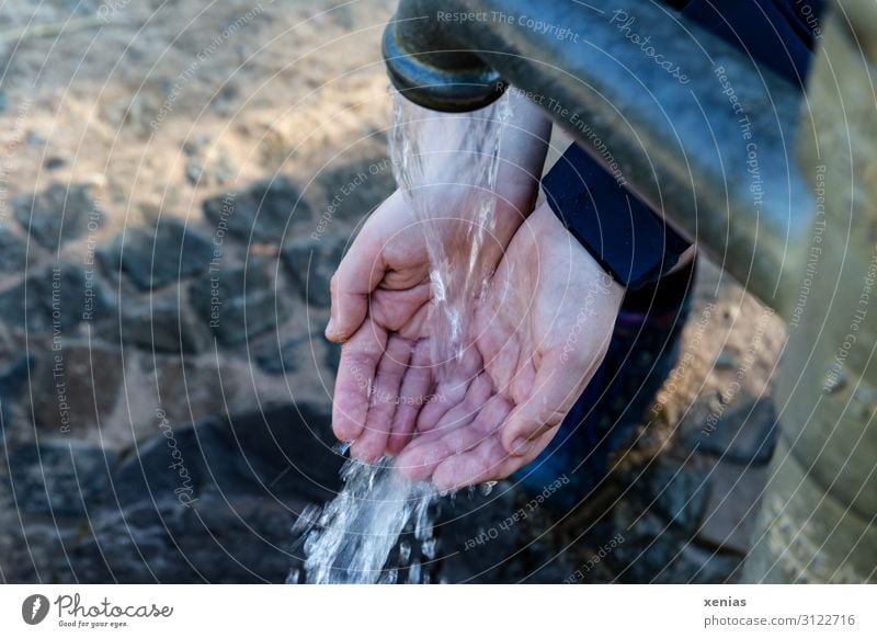 Fingertip sensitivity / Hands on the water pump Drinking water Young woman Youth (Young adults) Woman Adults by hand Fingers 1 Human being Water Climate change