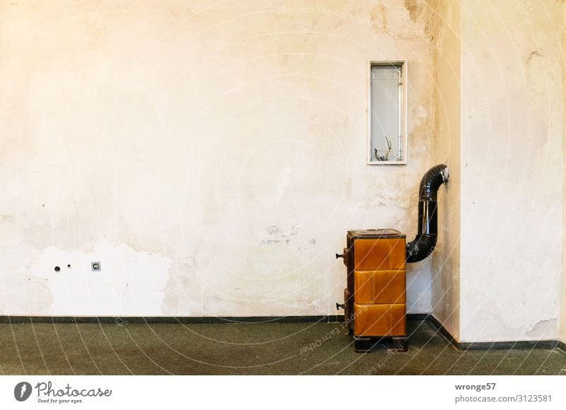 Empty room with oven Heating by stove House (Residential Structure) Building Old Retro Town Brown Gray White Room Vacancy Bleak Stove & Oven Stovepipe