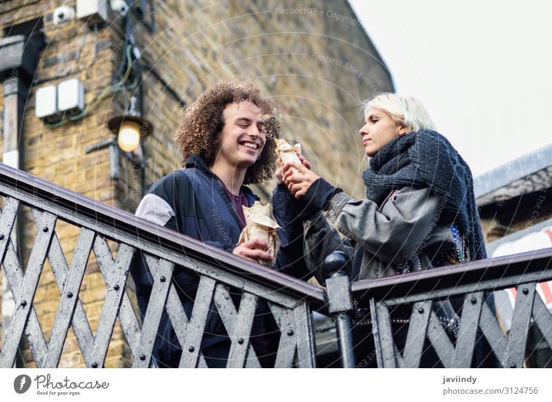 Happy couple eating Doner kebab, shawarma, in Camden Town Bread Lunch Dinner Fast food Joy Hair and hairstyles Vacation & Travel Tourism Human being Masculine