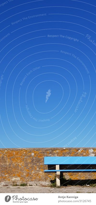 Blue bench in front of blue sky Meditation Vacation & Travel Summer Workplace Meeting Cloudless sky Beautiful weather Wall (barrier) Wall (building) Stone Wood