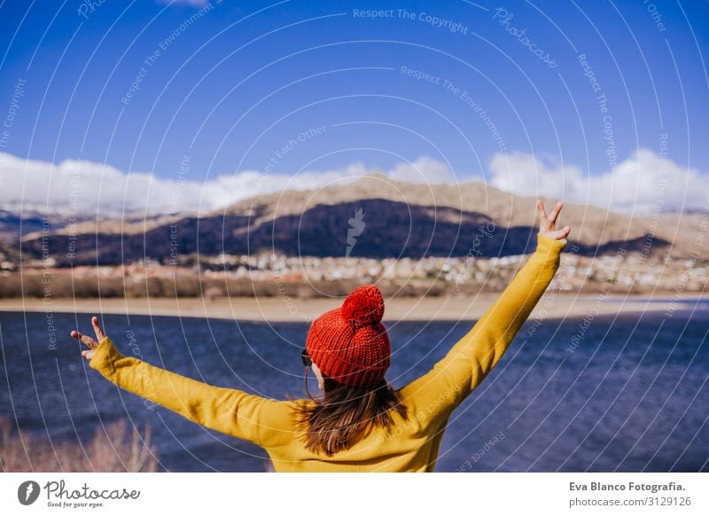 young caucasian woman on the mountain in sunny day. Beautiful lake background view. Nature concept. back view Surface Hat tour tourism Lovely Calm Mountain Day