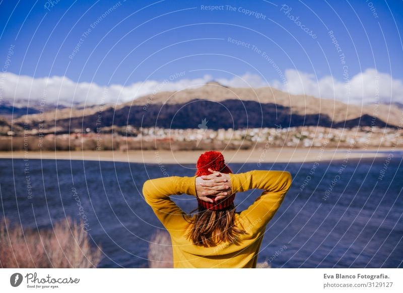 young caucasian woman on the mountain in sunny day. Beautiful lake background view. Nature concept. back view Surface Hat tour tourism Lovely Calm Mountain Day