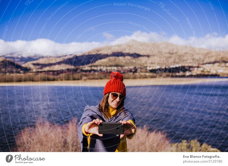 caucasian woman on the mountain using mobile phone. Sunny day Lifestyle Joy Beautiful Calm Leisure and hobbies Vacation & Travel Winter Mountain Cellphone PDA