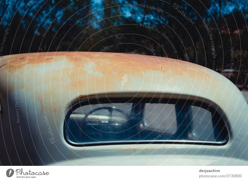 An old car - desert car . Parked at Uluru. The car is all red on the roof. It is taken from behind. Joy Trip Environment Summer Climate Beautiful weather Desert