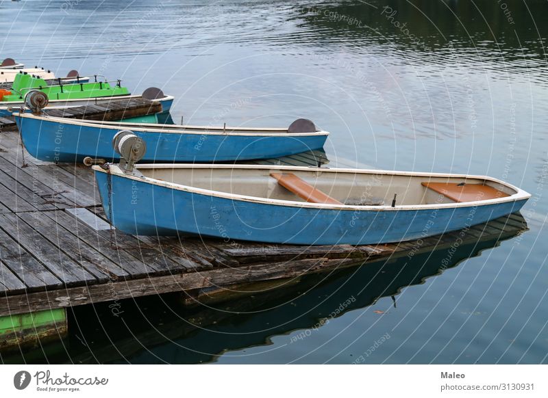 Fishing boats on the shore of the lake Beach Blue Watercraft Calm Coast Dusk Fisherman Fishing (Angle) Lake Leisure and hobbies Nature Natural Old Exterior shot