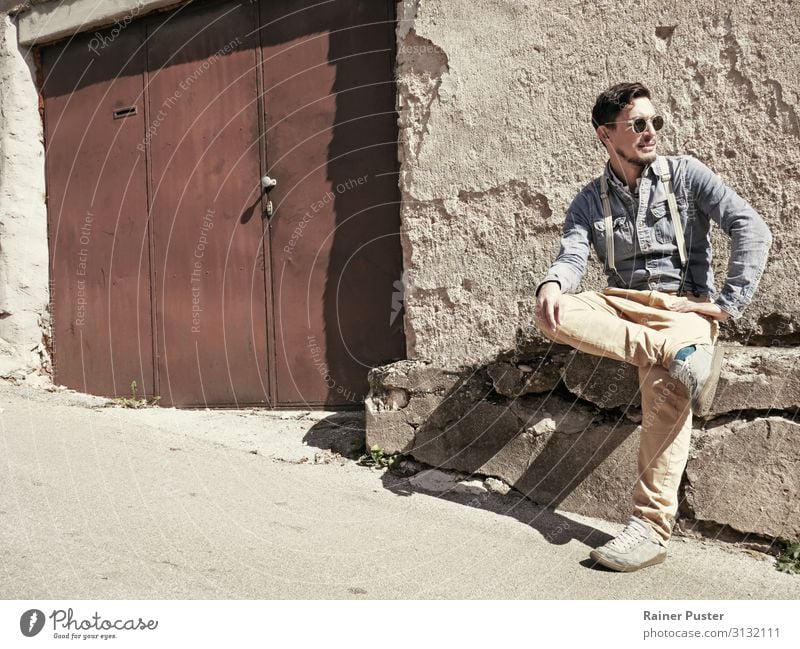 Man with sunglasses and suspenders in the sun Masculine Adults 1 Human being 30 - 45 years Sarajevo Bosnia-Herzegovina Ruin Pants denim shirt chino Sunglasses