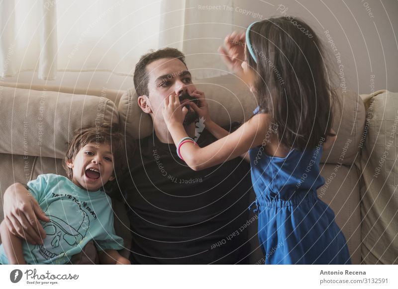 Father and daughter at home playing in sofa Lifestyle Sofa Living room Child Human being Boy (child) Man Adults Family & Relations Infancy Love Sit Together