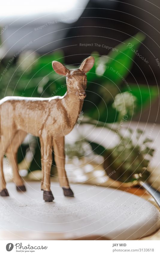 Holiday place setting and toy golden reindeer on the dish Dinner Plate Happy Winter Decoration Table Restaurant Thanksgiving Christmas & Advent New Year's Eve